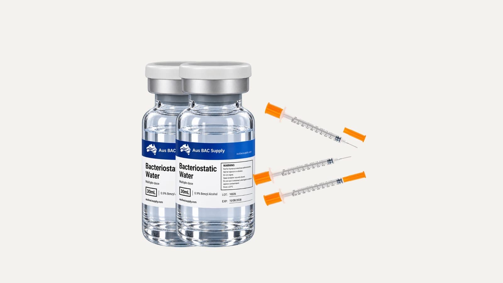 Two 30 mL multi-dose vials beside a row of insulin syringes.
